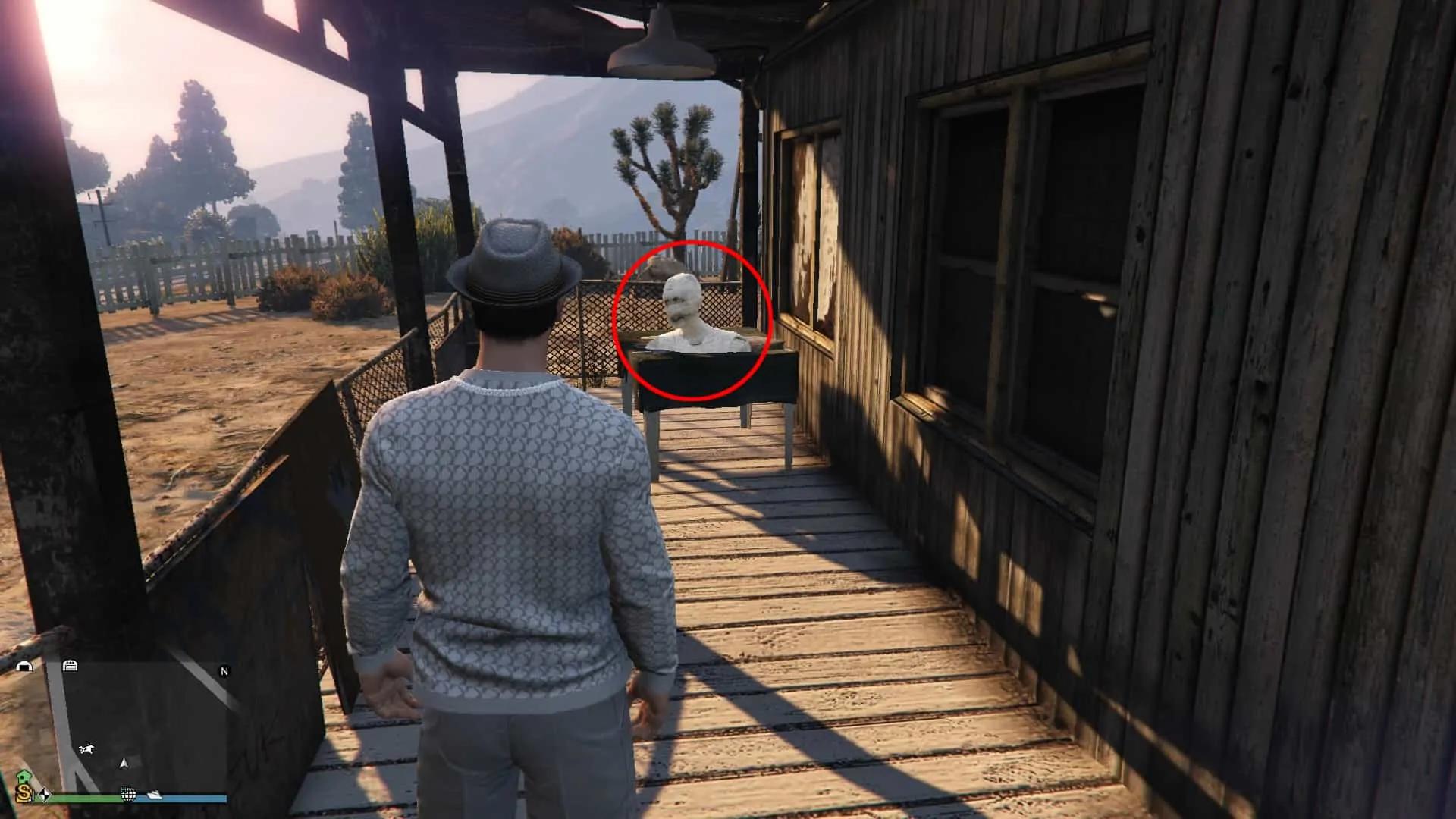 Mummy head on the table in the front porch