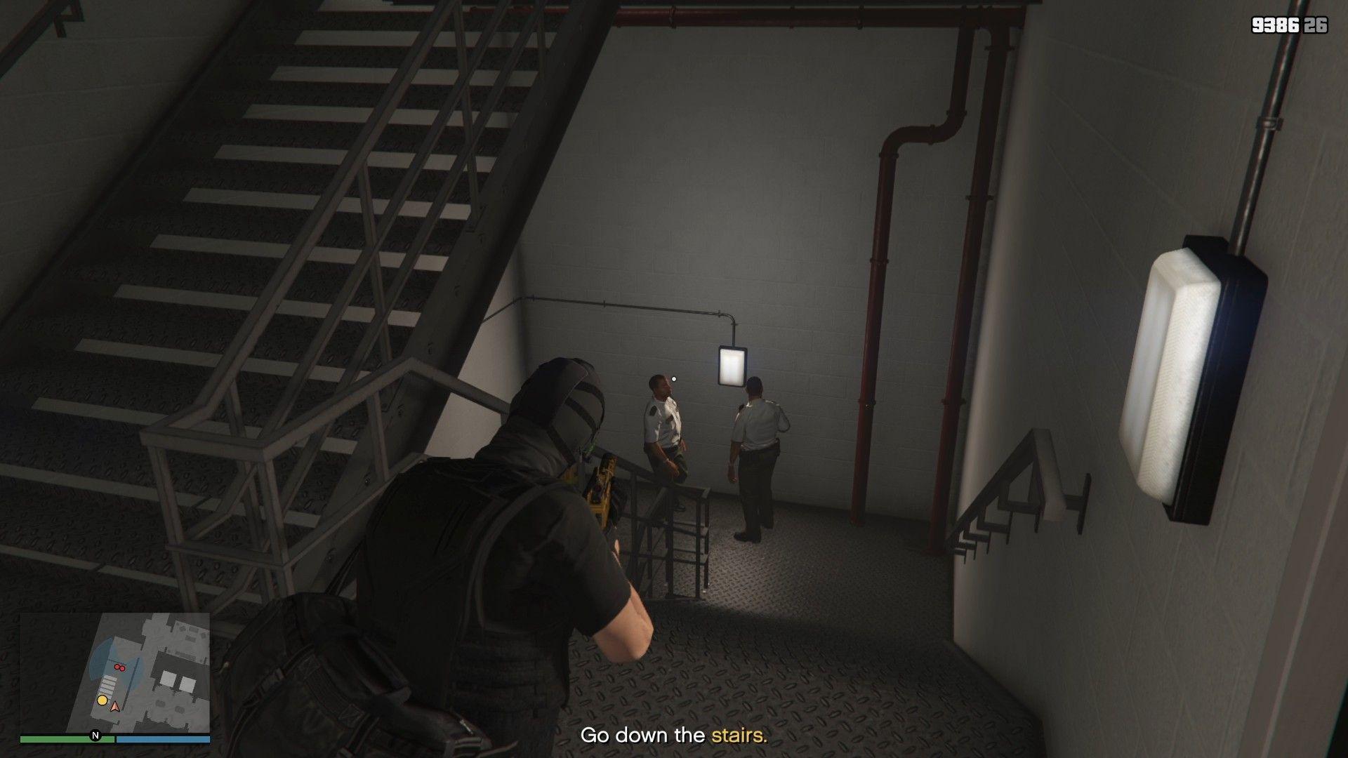 Two guards having a conversation in the middle of the stairwell.