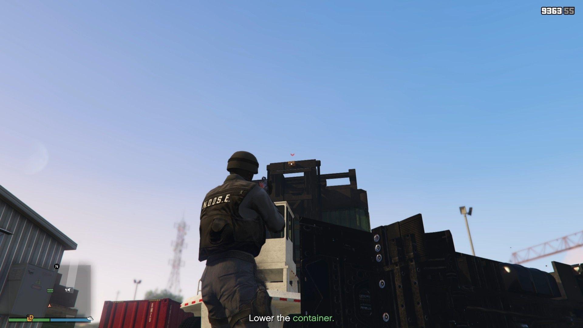 Shooting the lock to lower the container.