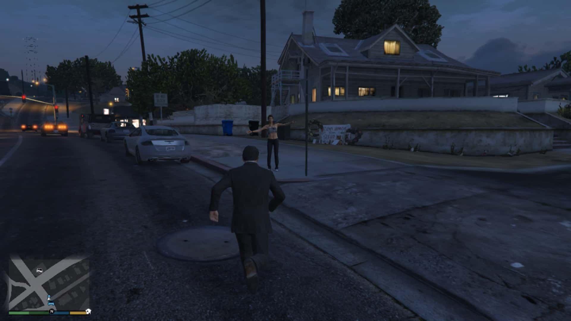 Woman on the sidewalk waving her hand calling for help