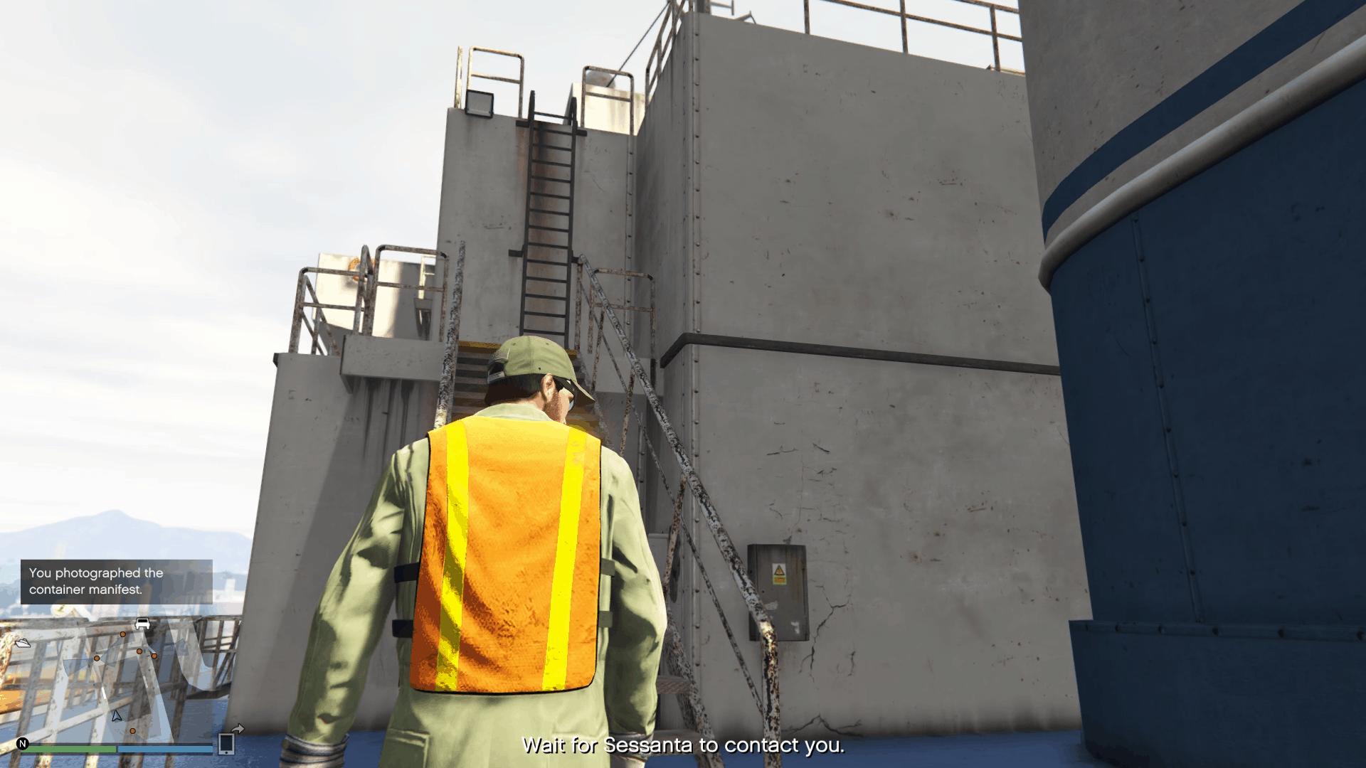 Set of stairs and ladders leading to the stack of green crates