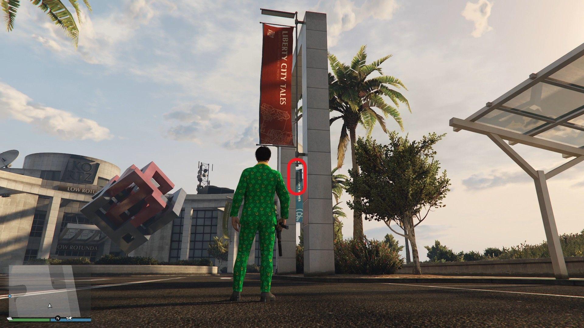 The golden clover will be hanging on the metal support holding the Liberty City Tales banner outside the Kortz Center in Pacific Bluffs.