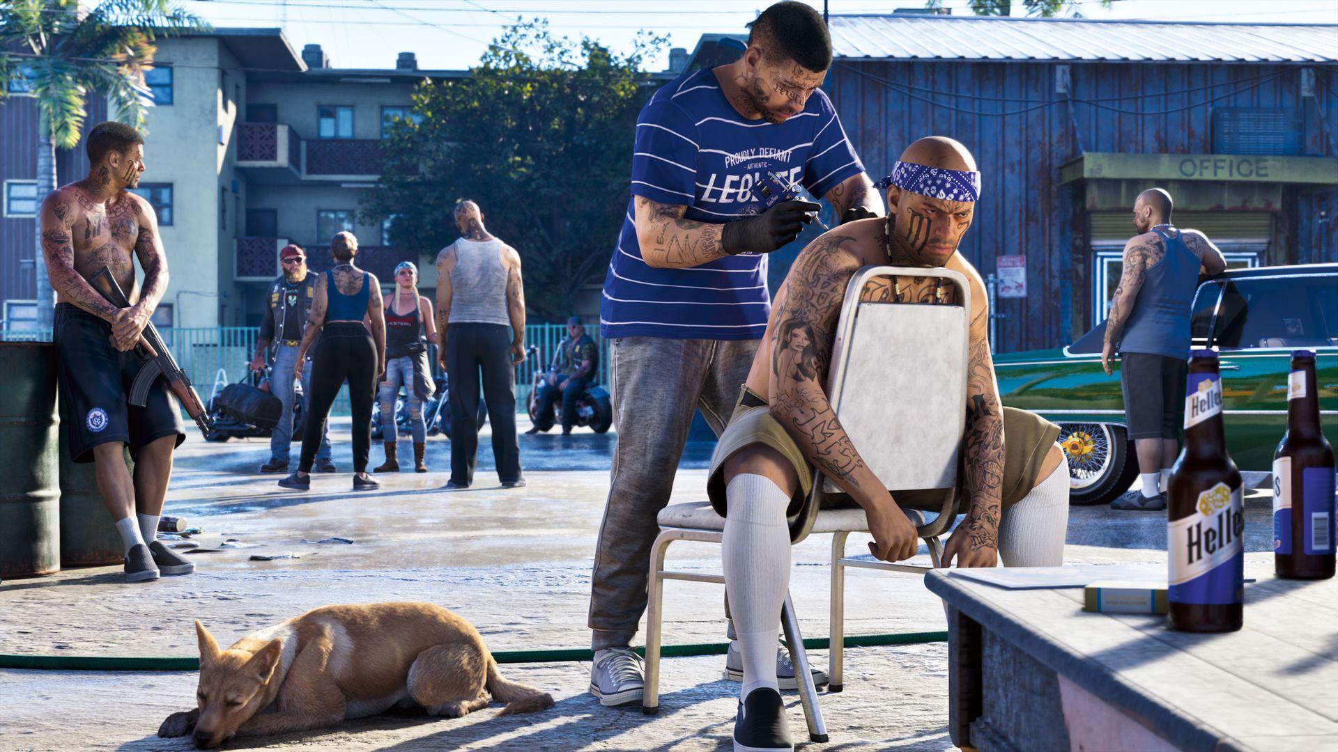 A man gives another man a tattoo in a yard while a dog rests nearby.