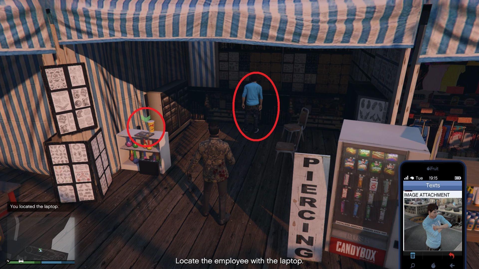 The Cluckin' Bell employee and the laptop near him.