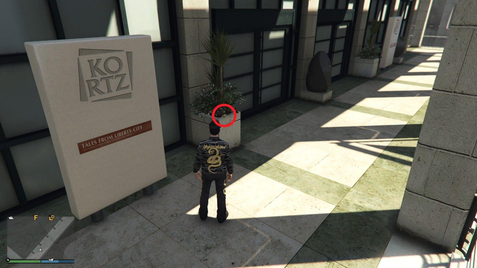 On the planter near the fountain on the second floor at the Kortz Center.