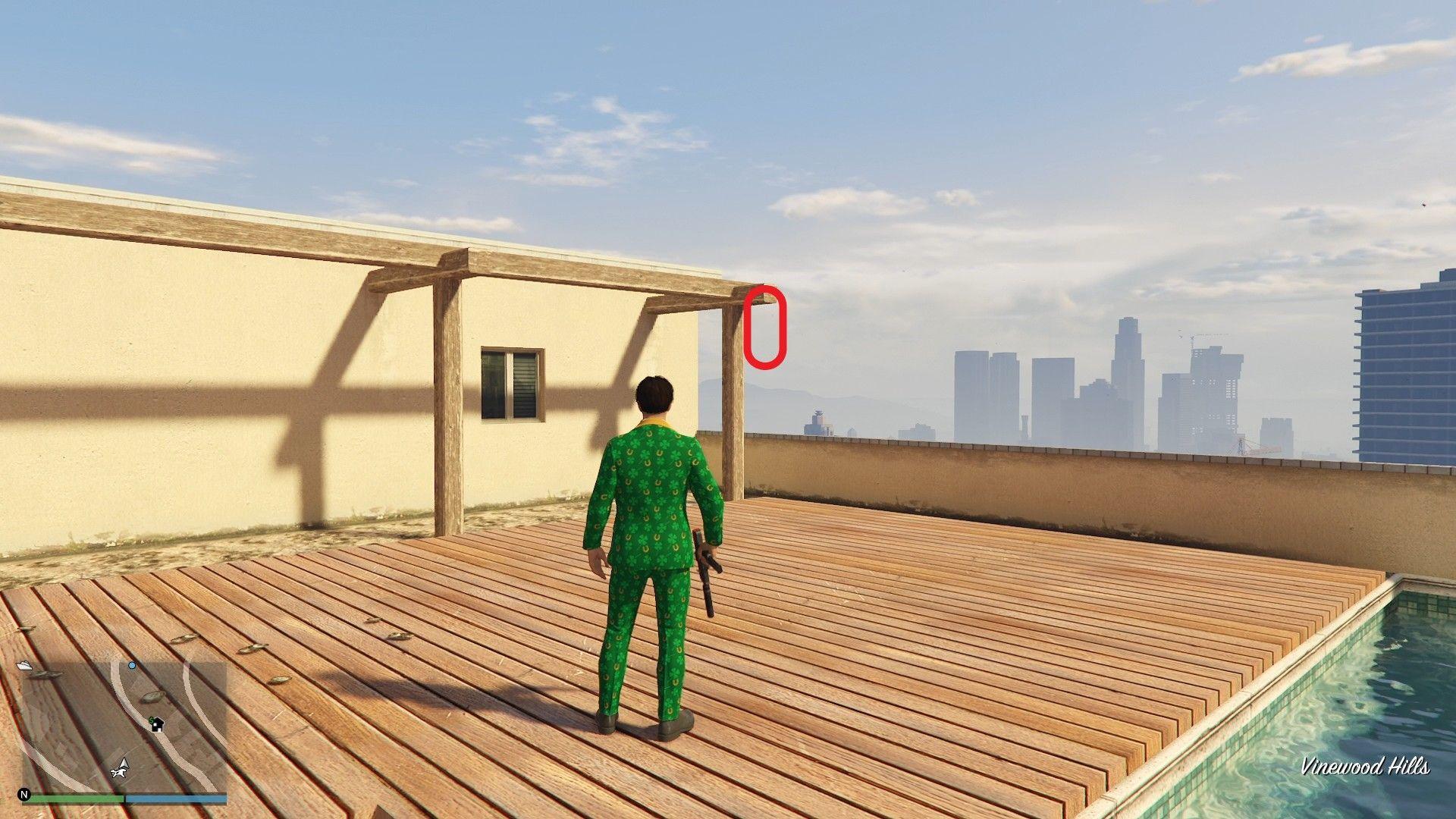 The golden clover will be hanging on the pergola of a rooftop pool deck of a house in Vinewood Hills.
