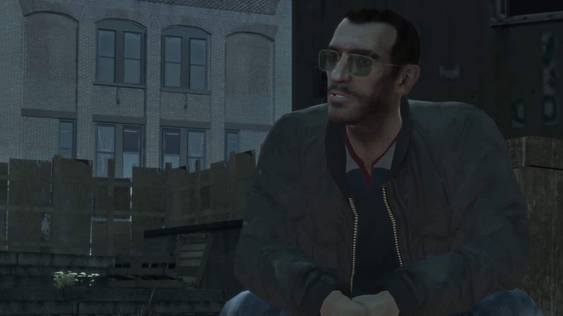Niko Bellic in GTA IV wearing sunglasses and a leather jacket.
