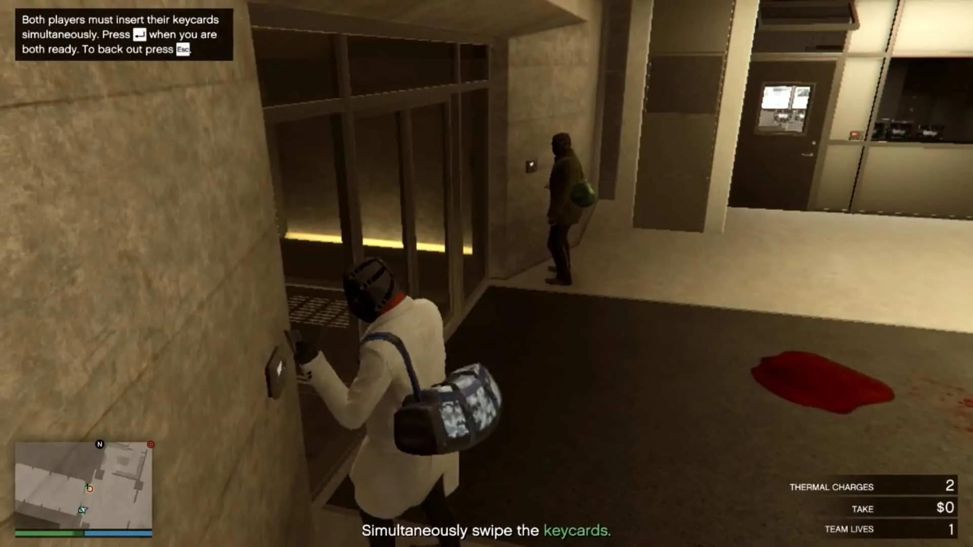 Simultaneously swiping the keycards to open the entrance to the mantrap leading to the vault