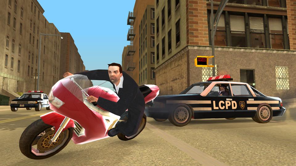 Toni Cipriani on a motorcycle beside an LCPD patrol car in Grand Theft Auto: Liberty City Stories.